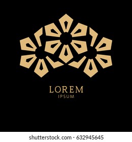 Abstract floral symbol. Graphic vector logo. Gold pattern on a black background