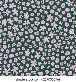 Abstract flower heads seamless repeat pattern. Random placed, vector floral all over surface print on dark green background.