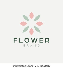 Abstract flower and leaves logo design. Cosmetics oe fashion logotype. Luxury and modern logo.