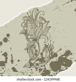 Abstract flower, stained with ink on torn sheet of paper