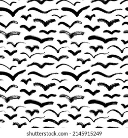 Abstract flying birds vector seamless pattern. Hand drawn black bird silhouettes on white background. Black curved lines and wavy brushstrokes. Abstract wallpaper design, trendy textile print. 