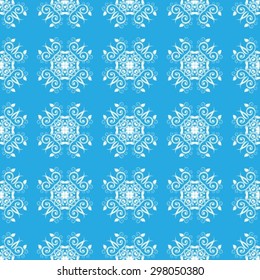 Abstract gentle seamless floral pattern on a blue background.