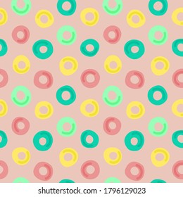 Abstract gentle seamless pattern with circles - donuts. Beautiful modern print for textile, fabric, page fill, wallpaper, packaging, design. Hand drawn vector illustration with colorful rings.
