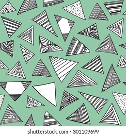 Abstract geometric background with hand drawn black and white triangles set. Vector seamless modern pattern.