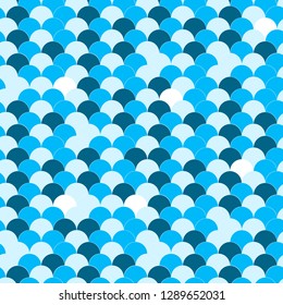 Abstract geometric background on the marine theme. Seamless waves blue pattern or squama texture.