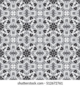 Abstract geometric background. Seamless vector pattern in grayscale colors. Ethnic boho style. Mosaic ornament structure. Carpet fragment.