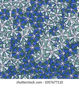 Abstract geometric flowers from triangles are randomly distributed. Seamless pattern.
