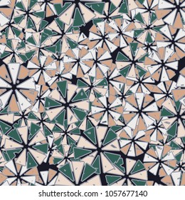 Abstract geometric flowers from triangles are randomly distributed. Seamless pattern.