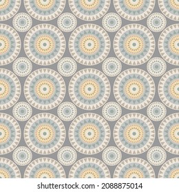 Abstract geometric mandala pattern. Colorful ethnic ornament. Circle triangle pattern on grey background.