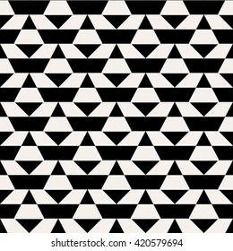 Abstract geometric monochrome pattern with stripes, bricks, random geometric shapes. Vector seamless abstract print in op art style. Black and white bold textile design for fall winter fashion