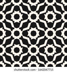 Abstract geometric ornamental seamless pattern. Black and white background. Simple ornament with floral shapes, net, lattice, mesh, grid. Elegant monochrome graphic texture. Dark repeat design 