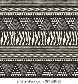 Abstract geometric seamless black and white pattern. Triangles and zebra print. Bohemian, hipster, hippie, tribal, ethnic, aztec, navajo, mayan, african design. Suitable for fashion prints and paper.