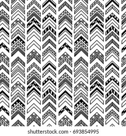 Abstract geometric seamless hand drawn pattern with tribal motifs. Modern texture. Monochrome free hand background.