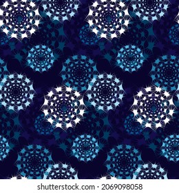 Abstract geometric seamless pattern. Circles, snowflakes, stars, galaxies in space backdrop. Blue and white on dark blue background