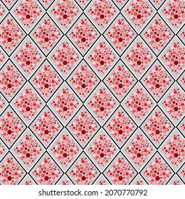 Abstract geometric seamless pattern. Diamond ornament filled with red and pink dots and circles. For textile and paper design