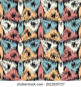 Abstract geometric seamless pattern in doodle style with colored triangular segments.
