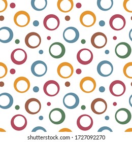 Abstract geometric seamless pattern with hollow circles and circle of different sizes. Simple colorful abstract background. Design for print, fabric, textile, furniture, packaging