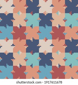 Abstract geometric seamless vector pattern with stylised little flowers on a colourful chessboard in retro style. Decorative floral grid texture in vintage colour scheme for wallpaper and prints. 