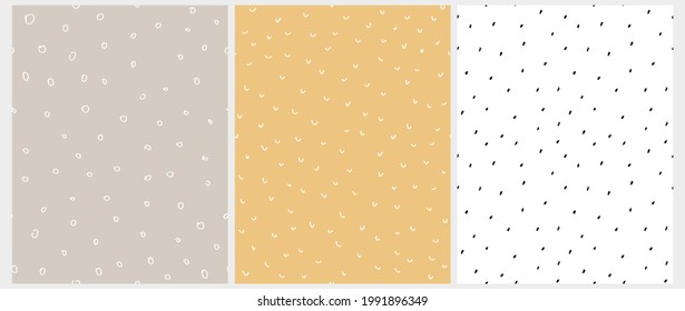 Abstract Geometric Seamless Vector Pattern with White and Black Irregular Brush Spots Isolated on a Dusty Beige, Pale Yellow and White Background. Cute Simple Hand Drawn Repeatable Print. 
