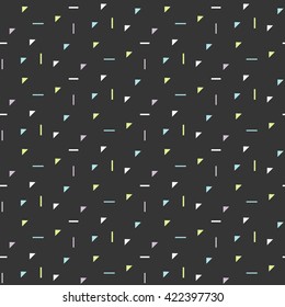 Abstract geometric shapes dark seamless pattern. Vintage geometry inspired seamless lilac, green and blue triangles on dark background.