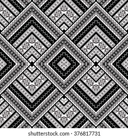 Abstract geometric striped ethnic background in black and white, vector seamless pattern