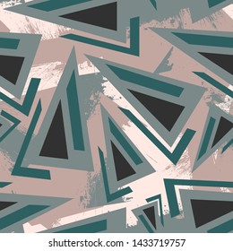 Abstract geometry seamless pattern with chaotic triangle elements.