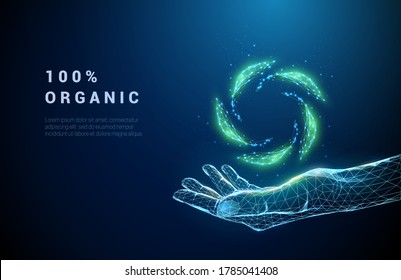 Abstract giving hand with falling green leafs. Low poly style design. Blue geometric background. Wireframe light connection structure. Modern 3d graphic ecology concept. Isolated vector illustration.