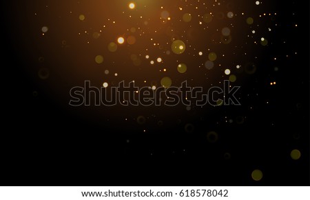 Abstract glitter light on black background with gold bokeh