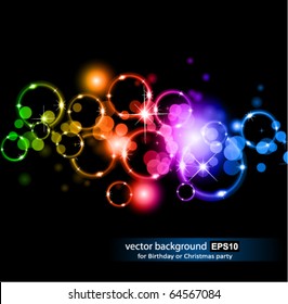 Abstract Glowing Circles of llight with Raibow Colours Background