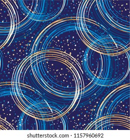 Abstract gold and blue luxury space seamless pattern for background, wrapping paper, fabric, surface design. Round decorative repeatable motif 
