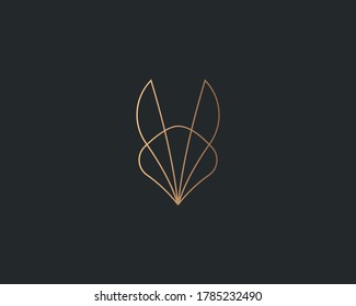 Abstract gold gradient fox bunny ears logo design vector. Luxury hotel, spa, massage, heritage logotype concept icon.