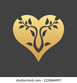 Abstract gold heart tree concept on a black background. Tree in heart.