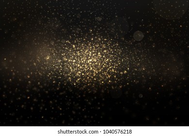 Abstract gold sparkles on black background.  Abstract falling gold lights. Fantasy fractal texture.  Design template for card, invitation, Decorative element. Vector illustration.