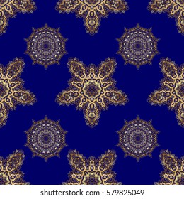 Abstract golden elements on a blue background. Vector shiny metal surface seamless pattern.