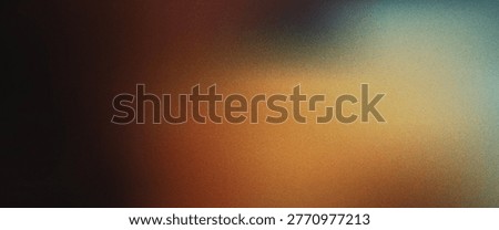 Abstract gradient background with grainy texture featuring blue orange brown and black hues blend together