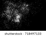 Abstract grainy texture isolated on black background. Top view. Dust, sand blow or bread crumbs. Silhouette of food flakes such as salt or almond or wheat flour spread on the flat surface or table. 