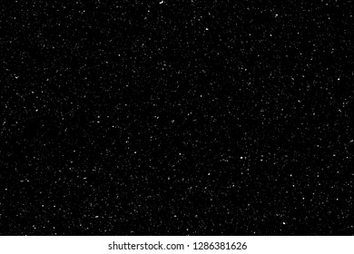Textura granulada abstracta aislada sobre fondo negro. Vista superior. Polvo, arena sopla Silueta de esparcido en la superficie plana o mesa. 