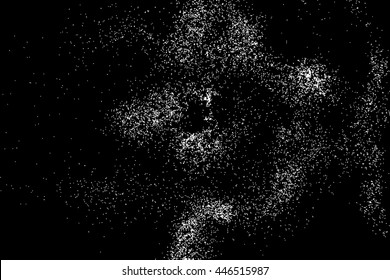 Abstract grainy texture isolated on black background. Silhouette of food flakes such as salt or almond or wheat flour spread on the flat surface or table. Top view. Dust, sand blow or bread crumbs.