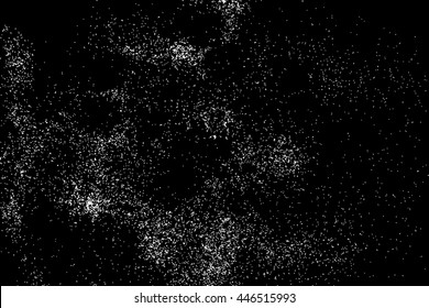 Abstract grainy texture isolated on black background. Silhouette of food flakes such as salt or almond or wheat flour spread on the flat surface or table. Top view. Dust, sand blow or bread crumbs.