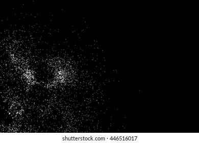 Abstract grainy texture isolated on black background. Silhouette of food flakes such as salt or almond or wheat flour spread on the flat surface or table. Top view. Dust, sand blow or bread crumbs.