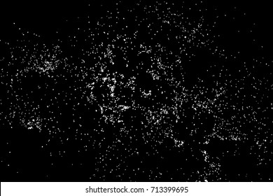 Abstract grainy texture isolated on black background. Top view. Dust, sand blow or bread crumbs. Silhouette of food flakes such as salt or almond or wheat flour spread on the flat surface or table. 