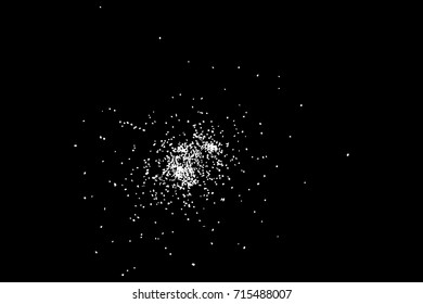 Abstract grainy texture isolated on black background. Top view. Dust, sand blow or bread crumbs. Silhouette of food flakes such as salt or almond or wheat flour spread on the flat surface or table. 