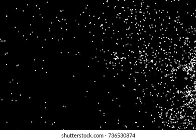 Abstract grainy texture isolated on black background. Top view. Dust, sand blow or bread crumbs. Silhouette of food flakes such as salt or almond or wheat flour spread on the flat surface or table. 