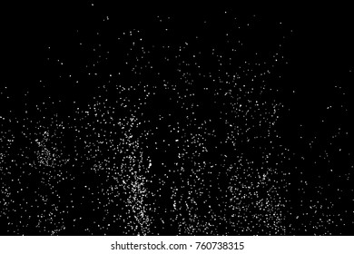 Abstract grainy texture isolated on black background. Top view. Dust, sand blow or bread crumbs. Silhouette of food flakes such as salt or almond or wheat flour spread on the flat surface or table. 