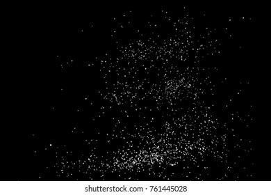 Abstract grainy texture isolated on black background. Top view. Dust, sand blow or bread crumbs. Silhouette of food flakes such as salt or almond or wheat flour spread on the flat surface or table. 