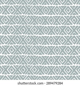 Abstract gray  background with a diamond and a cross brush strokes. Vector seamless pattern.