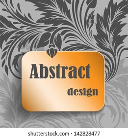 abstract gray background with an ornament and a gold card for the text