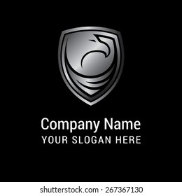 Abstract Gray vintage label Eagle Bird shield. Eagle symbols isolated on black background for mascot or emblem design, also a logo idea. 