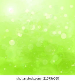 Abstract green background with watercolor splashes and swashes 