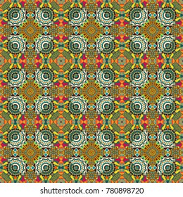 Abstract green, blue and orange psychedelic print. Seamless impressive Mandalas pattern. Fabric, wallpaper, cloth and textile design. Modern urban dazzle paint. Vector eco-styled background.